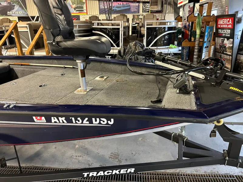 Slide: The Image of 2019 Tracker Pro Team 175 TF boat in showroom, featuring seating and equipment. - 5
