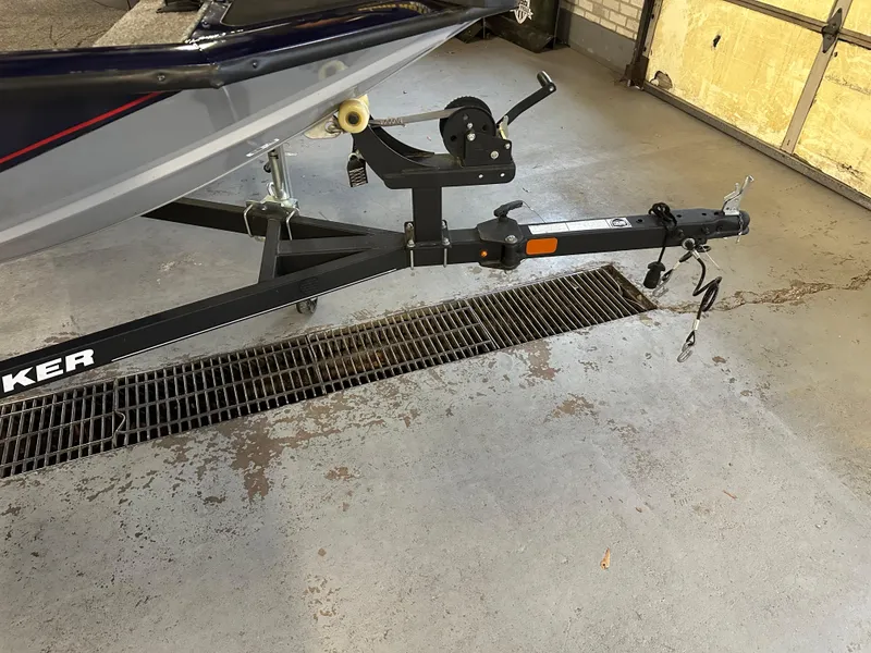 Slide: The Image of 2019 Tracker Pro Team 175 TF boat trailer in a garage setting. - 6