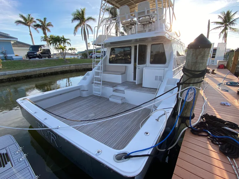 Slide: The Image of Mares 58 Power Cat 1995 docked, featuring spacious deck and modern design. - 20
