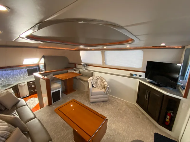 Slide: The Image of Luxurious interior of 1995 Mares 58 Power Cat with modern furnishings and entertainment area. - 32
