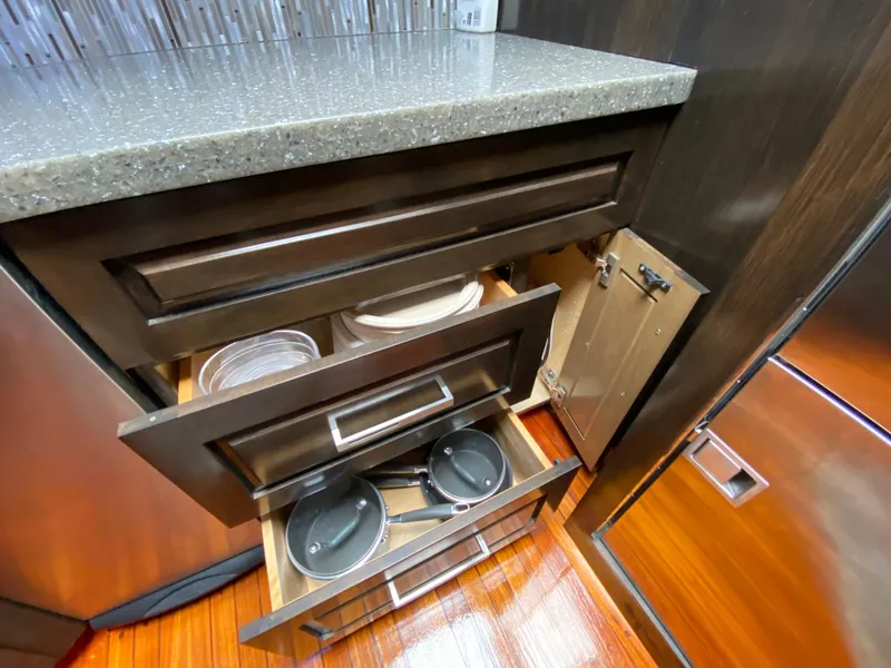 Slide: The Image of Kitchen drawers with cookware and dishes in a 1995 Mares 58 Power Cat. - 44