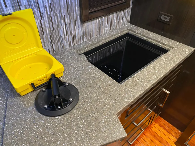Slide: The Image of Kitchen countertop on 1995 Mares 58 Power Cat with yellow case and modern sink. - 46