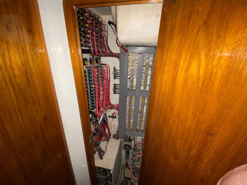 Slide: The Image of Electrical panel inside 1995 Mares 58 Power Cat, showcasing wiring and circuit components. - 50