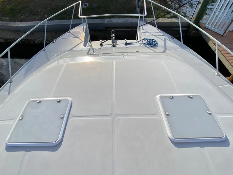 Slide: The Image of Deck view of 1995 Mares 58 Power Cat with hatches and railing. - 7