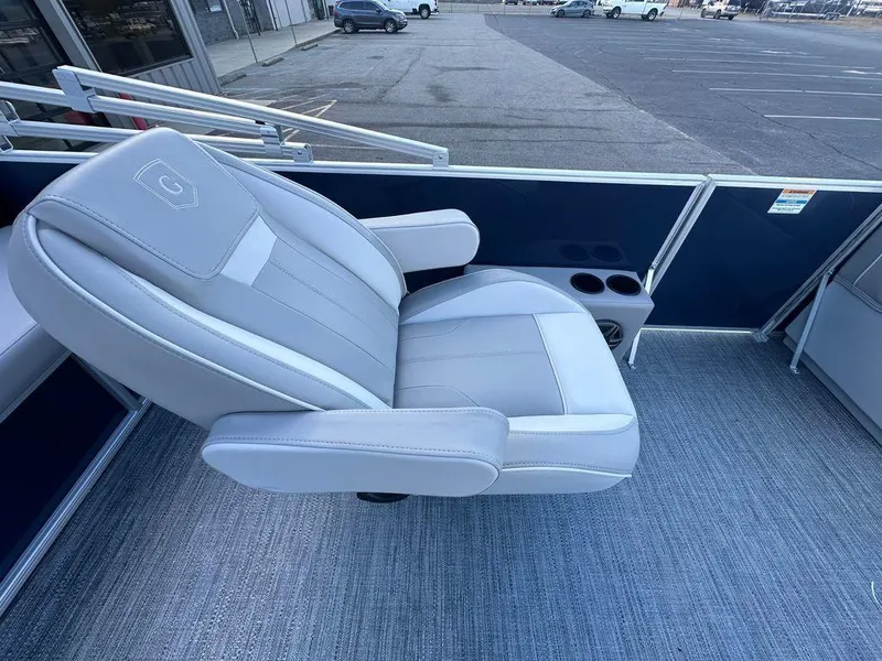 Slide: The Image of 2025 Godfrey Xperience 2286 SFLX boat seat with armrests and cup holders. - 4