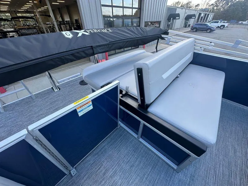 Slide: The Image of 2025 Godfrey Xperience 2286 SFLX pontoon boat interior with gray seating and open deck. - 7