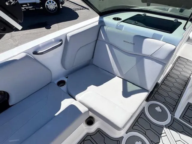 Slide: The Image of 2022 MasterCraft NXT20 boat interior with sleek seating and modern design. - 12