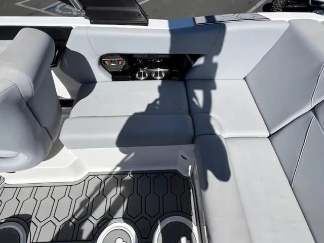 Slide: The Image of 2022 MasterCraft NXT20 boat interior with gray seating and modern design. - 15