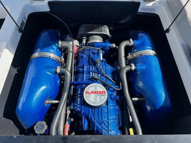 Slide: The Image of 2022 MasterCraft NXT20 engine with blue Ilmor components. - 19