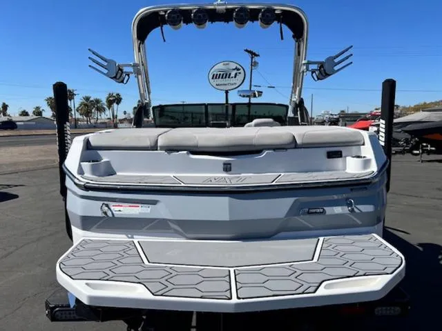 Slide: The Image of 2022 MasterCraft NXT20 boat rear view with swim platform and wakeboard tower. - 7