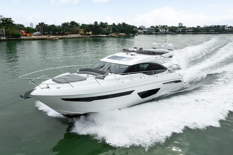 Slide: The Image of 2017 Princess S65 yacht cruising on a scenic waterway. - 2