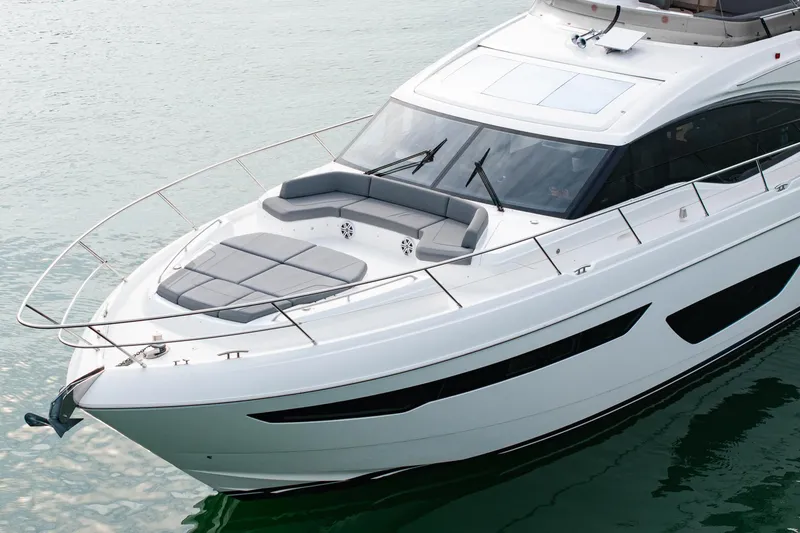 Slide: The Image of Luxury 2017 Princess S65 yacht on calm water, featuring sleek design and spacious deck. - 6