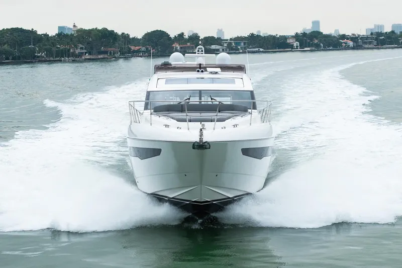 Slide: The Image of 2017 Princess S65 yacht cruising on a serene waterway. - 7
