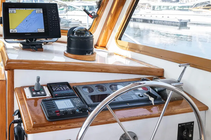 Slide: The Image of Helm of 1985 Wilbur 34 boat with navigation equipment and steering wheel. - 9