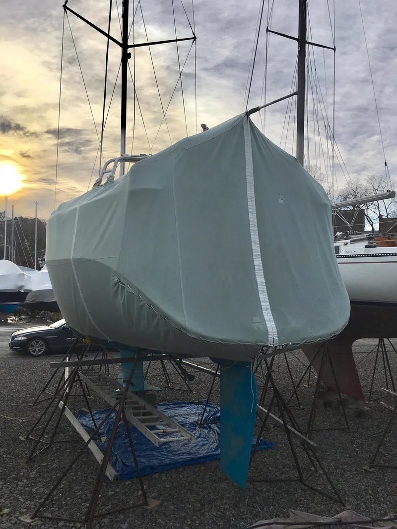 Slide: The Image of Sailboat Hunter 380 (2000) covered, docked at sunset, ready for storage. - 14