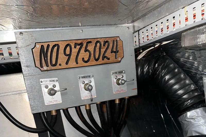 Slide: The Image of Control panel in 1991 Carver 33 Aft Cabin with switches and serial number 975024. - 48