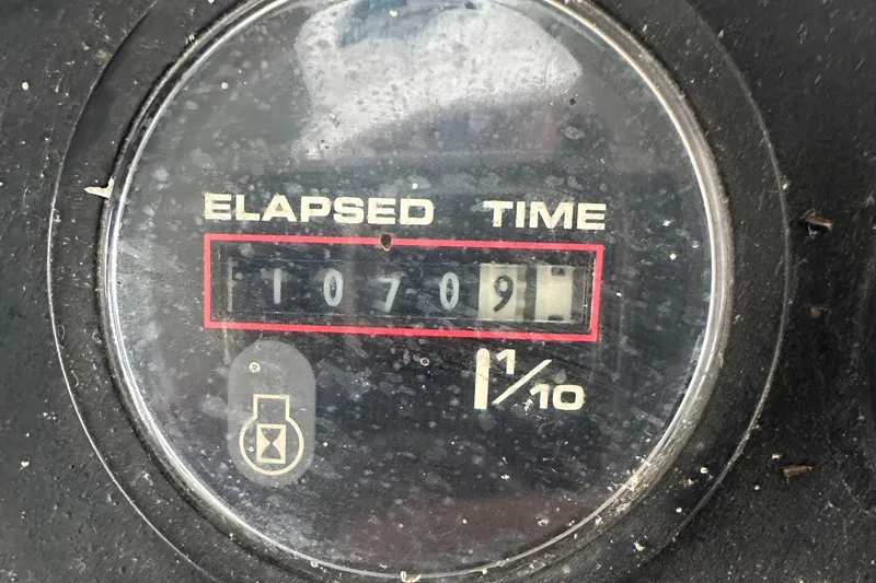 Slide: The Image of Elapsed time gauge reading 1070.9 hours on 1991 Carver 33 Aft Cabin. - 7