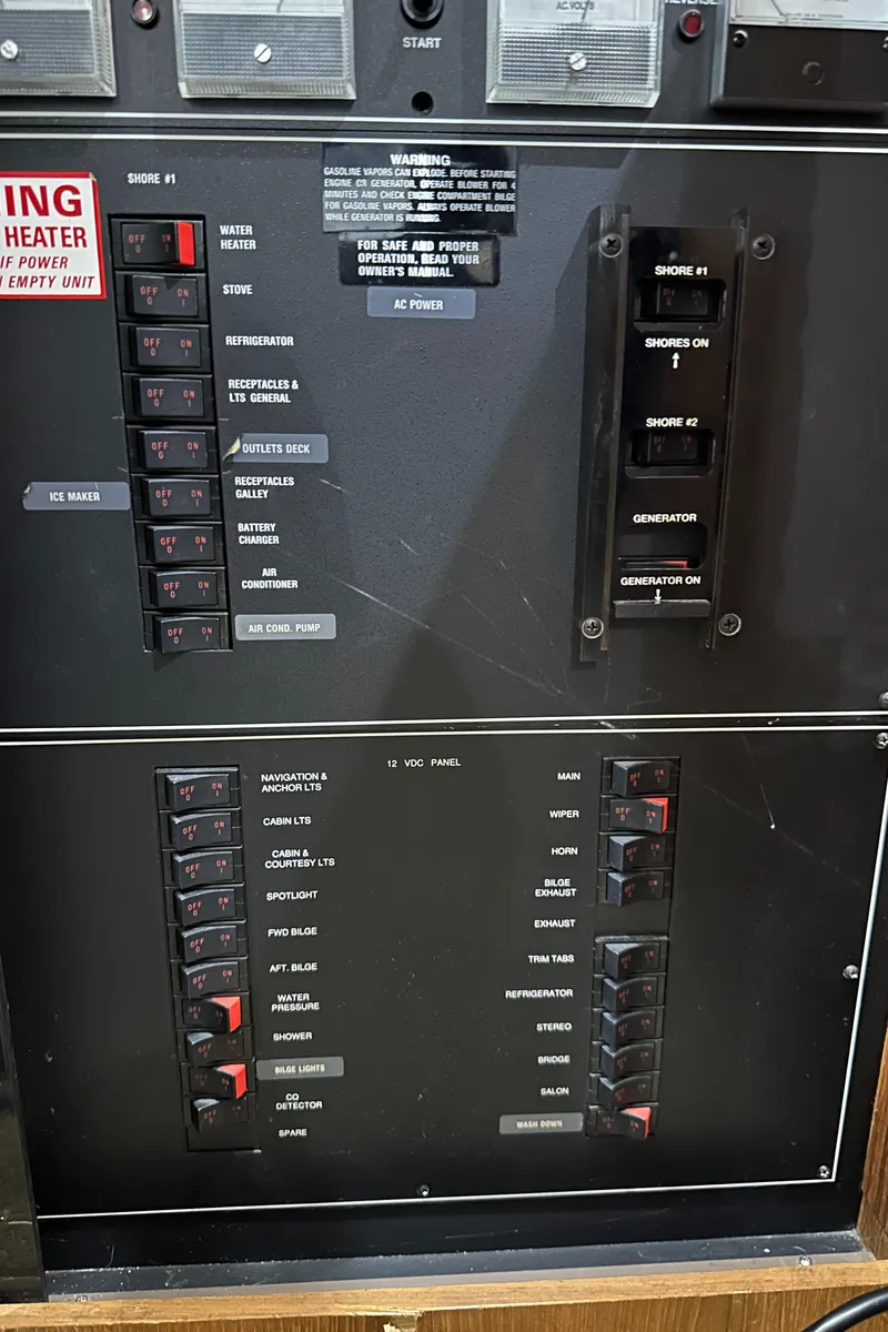 Slide: The Image of Control panel of a 1991 Carver 33 Aft Cabin boat with labeled switches and indicators. - 20