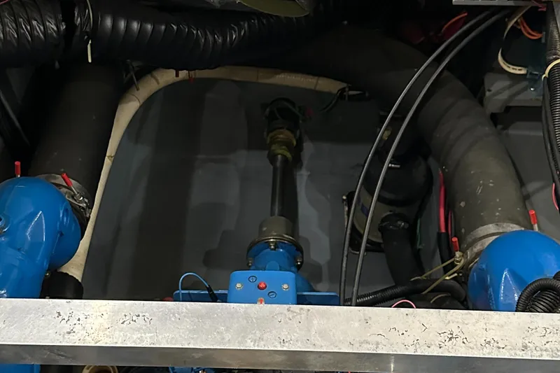 Slide: The Image of Engine compartment of a 1991 Carver 33 Aft Cabin boat, showing mechanical components. - 42