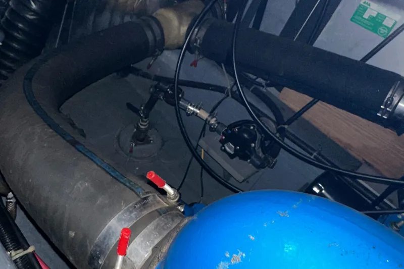 Slide: The Image of Engine compartment of 1991 Carver 33 Aft Cabin with hoses and components. - 47