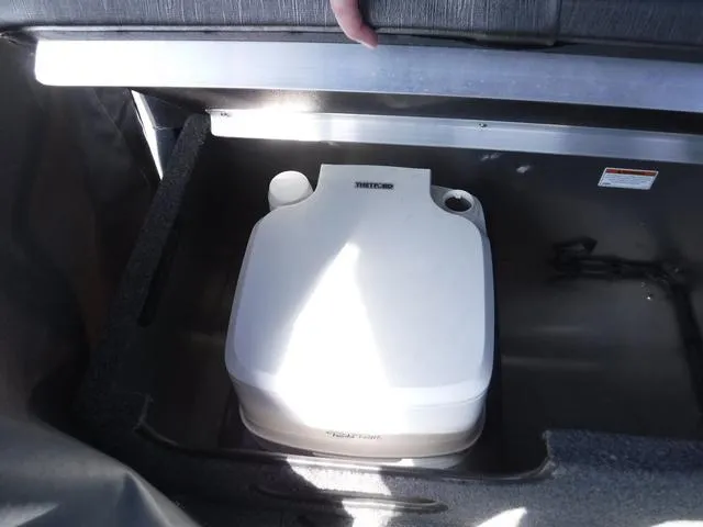 Slide: The Image of Portable toilet in 2023 Duckworth Pacific Navigator 22' boat storage compartment. - 12