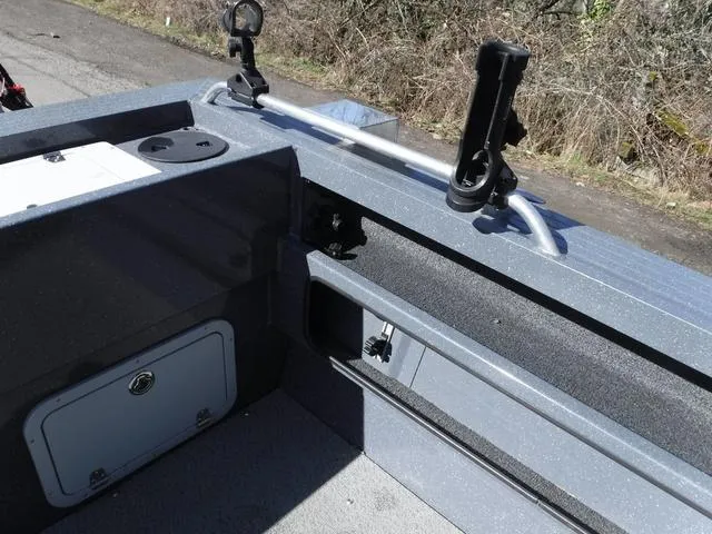 Slide: The Image of 2023 Duckworth Pacific Navigator 22' boat interior with rod holders and storage compartments. - 13