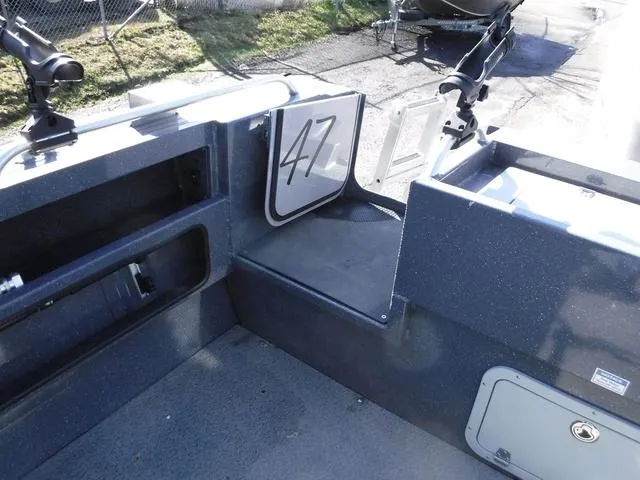 Slide: The Image of 2023 Duckworth Pacific Navigator 22' boat interior with storage compartments and rod holders. - 14