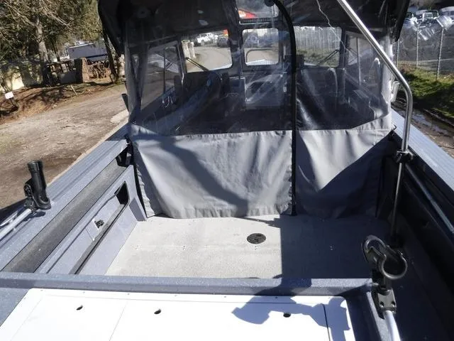 Slide: The Image of 2023 Duckworth Pacific Navigator 22' boat interior with canopy and spacious deck area. - 7