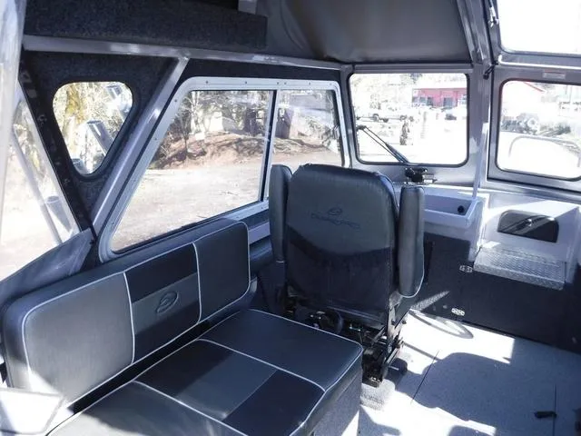 Slide: The Image of Interior of 2023 Duckworth Pacific Navigator 22' boat with seating and windows. - 9