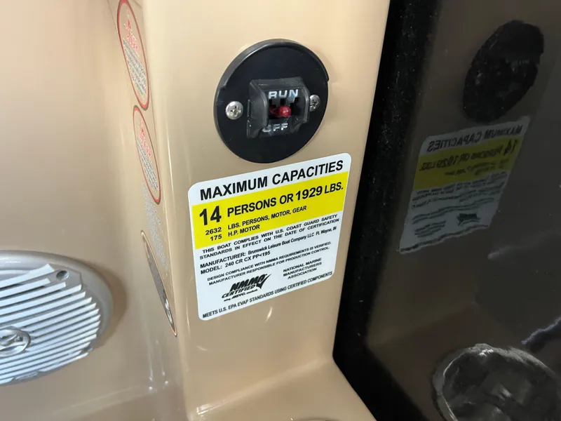 Slide: The Image of 2014 Harris Cruiser 240 capacity label, maximum 14 persons or 1929 lbs. - 10