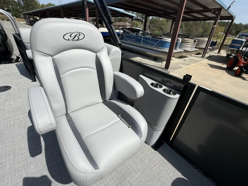 Slide: The Image of Luxurious seating on 2025 Bentley Pontoons Legacy Navigator 223, featuring cup holders and elegant design. - 12