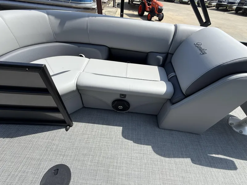 Slide: The Image of 2025 Bentley Pontoons Legacy Navigator 223 interior seating with gray upholstery and logo detail. - 4