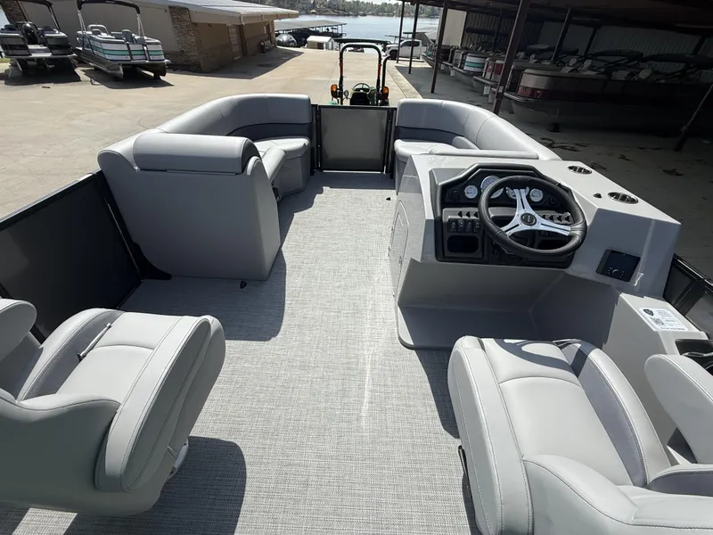 Slide: The Image of 2025 Bentley Pontoons Legacy Navigator 223 interior with modern seating and steering console. - 5