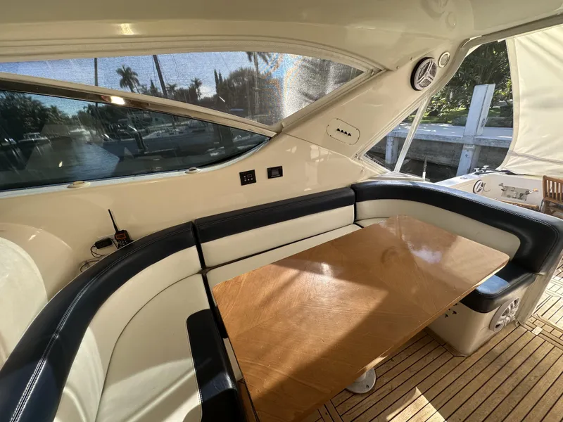 Slide: The Image of Luxurious interior of 1999 Uniesse 57 Open yacht with elegant seating and wooden table. - 26