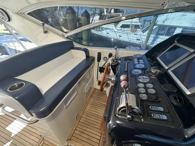 Slide: The Image of Helm of 1999 Uniesse 57 Open yacht with controls and seating. - 38