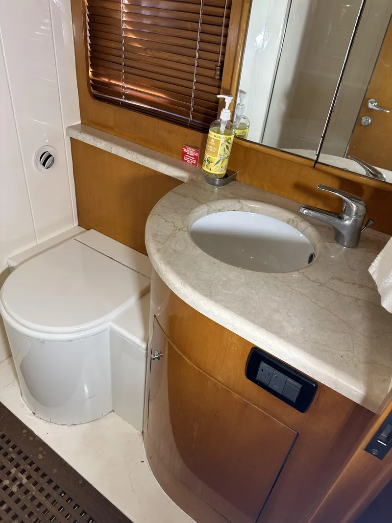Slide: The Image of Bathroom interior of 1999 Uniesse 57 Open yacht with sink and toilet. - 46