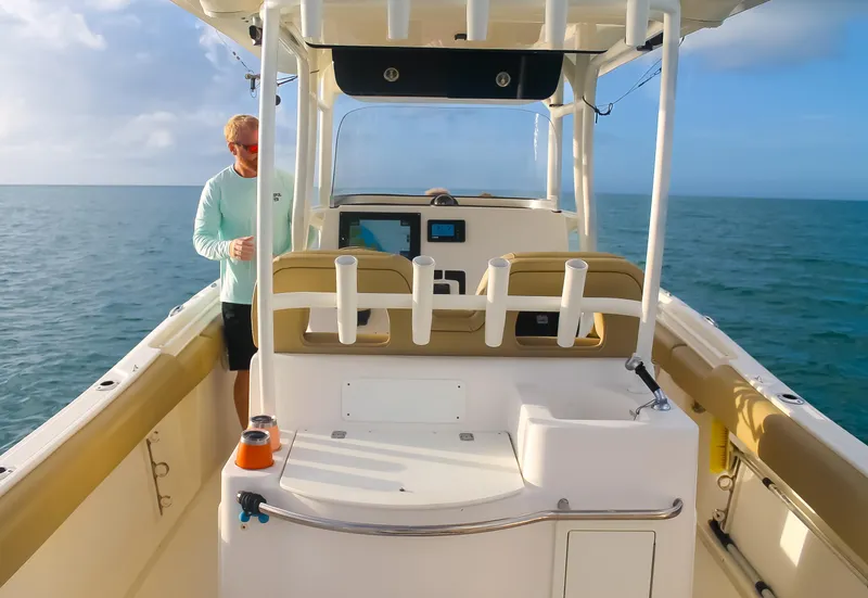Slide: The Image of 2017 Key West Billistic 261 Center Console on open water, featuring spacious deck and modern controls. - 10