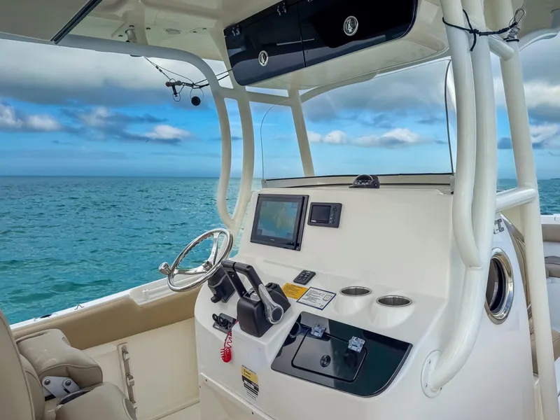 Slide: The Image of 2017 Key West Billistic 261 Center Console boat interior with ocean view. - 14