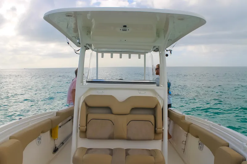Slide: The Image of 2017 Key West Billistic 261 Center Console boat on open water. - 15