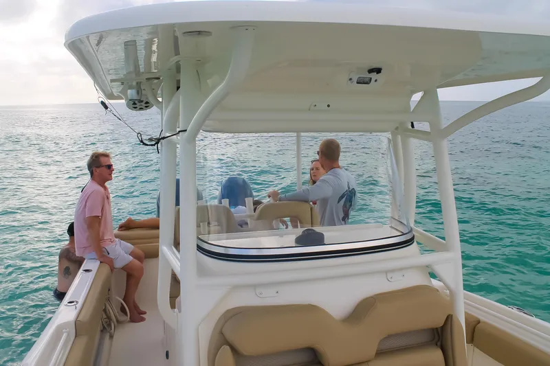 Slide: The Image of 2017 Key West Billistic 261 Center Console boat with people enjoying a day on the water. - 17