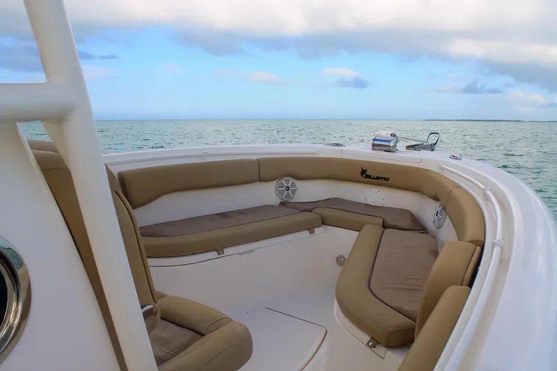 Slide: The Image of 2017 Key West Billistic 261 Center Console boat with cushioned seating, ocean view. - 21