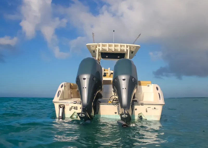 Slide: The Image of 2017 Key West Billistic 261 Center Console boat on open water, rear view. - 5