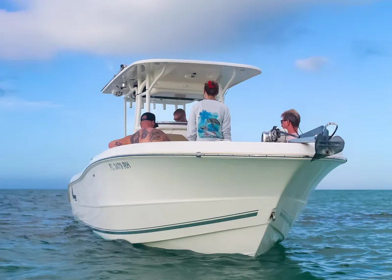 Slide: The Image of 2017 Key West Billistic 261 Center Console boat on calm ocean waters. - 9