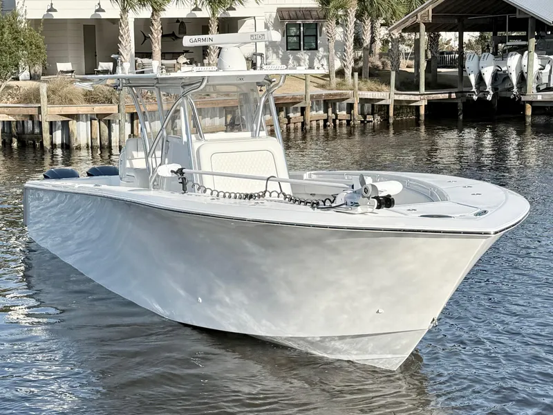 Slide: The Image of 2021 SeaHunter 35 Tournament boat docked on calm water. - 6