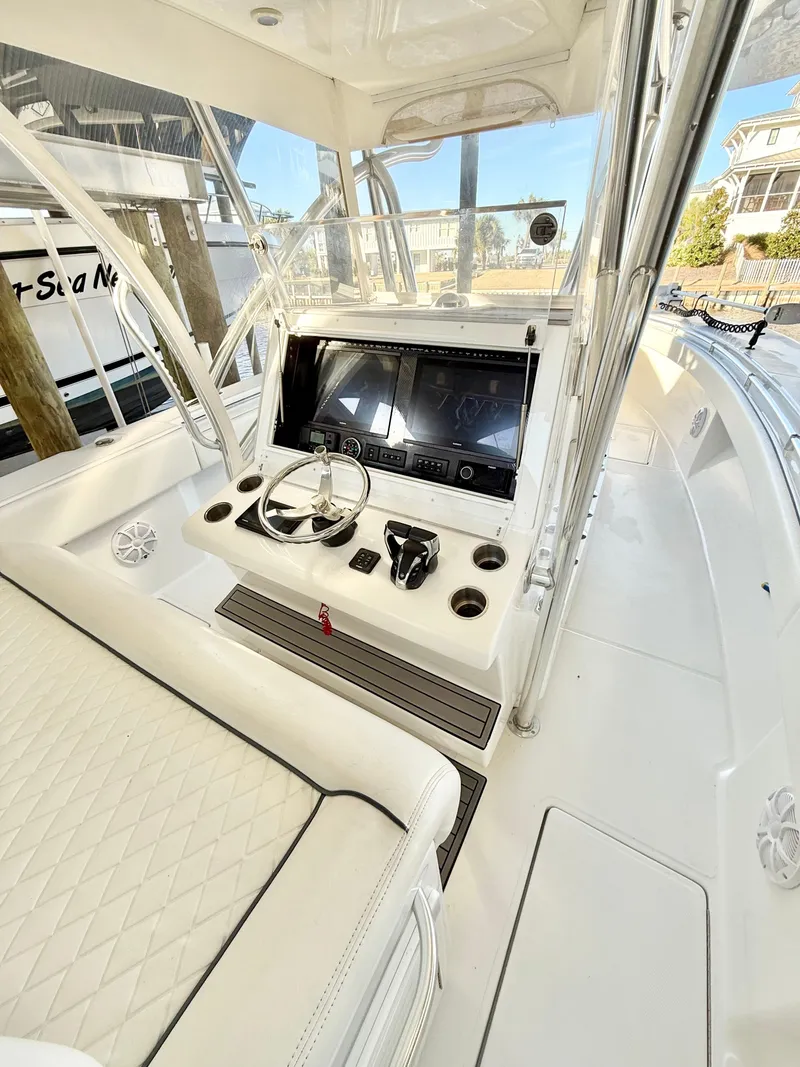 Slide: The Image of 2021 SeaHunter 35 Tournament boat interior with modern helm and seating. - 9
