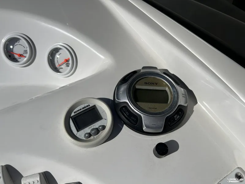 Slide: The Image of Control panel of a 2002 Nordic 28 Heat MCOB boat with gauges and Sony stereo. - 10