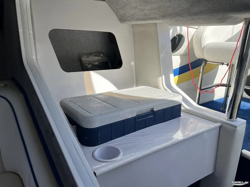 Slide: The Image of Interior of a 2002 Nordic 28 Heat MCOB boat with storage compartment and seating. - 16