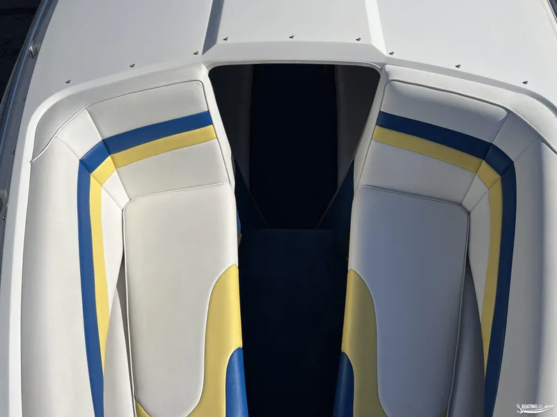 Slide: The Image of Nordic 28 Heat MCOB 2002 boat interior with white, blue, and yellow upholstery. - 18