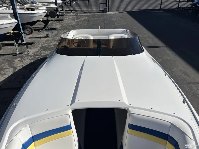 Slide: The Image of Nordic 28 Heat MCOB 2002 boat with sleek white design and colorful interior accents. - 19