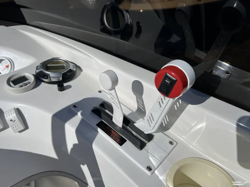 Slide: The Image of Control panel of a 2002 Nordic 28 Heat MCOB boat with throttle levers. - 6